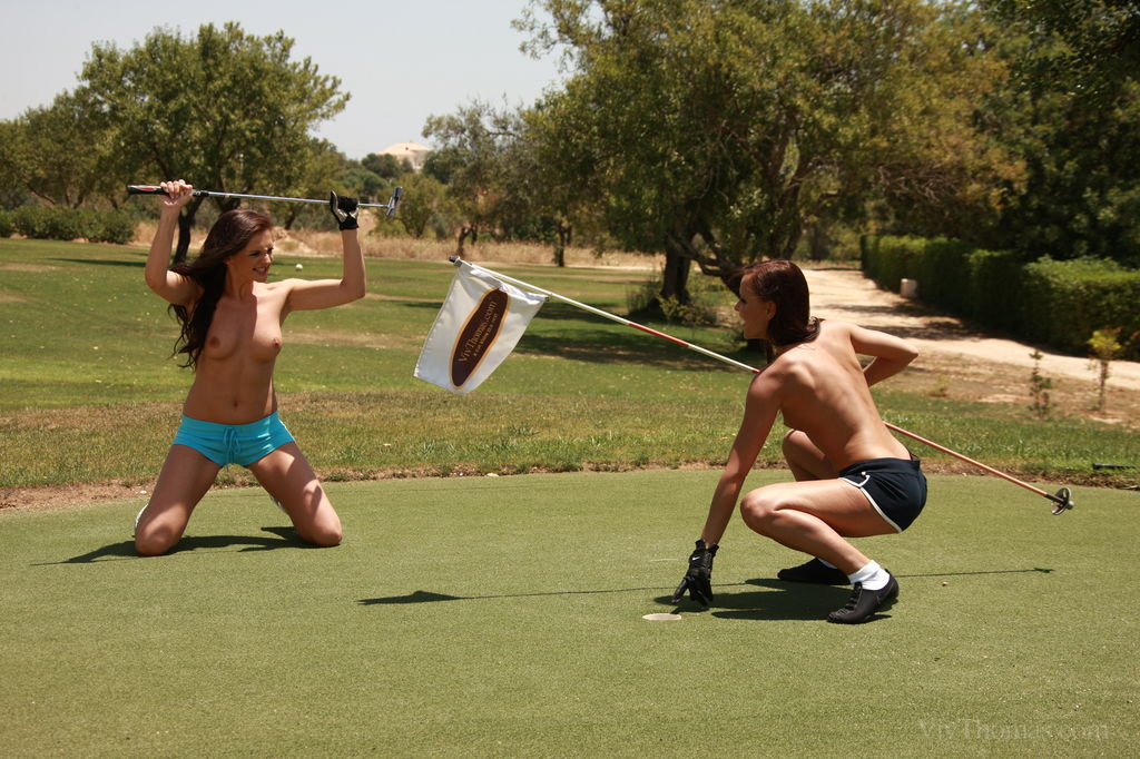 JO and Sandra Shine having topless fun under the sun, carefree and happy while taking turns putting in the golf course.